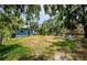 Expansive backyard with lush greenery and inviting seating area, perfect for outdoor relaxation and entertainment at 41 W Boyer St, Tarpon Springs, FL 34689