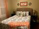 Bedroom with a bed with decorative pillows and lamps on the bedside tables at 41 W Boyer St, Tarpon Springs, FL 34689