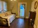 Bedroom with a bed with decorative pillows and lamps on the bedside tables at 41 W Boyer St, Tarpon Springs, FL 34689