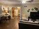 Cozy living room with hardwood floors that leads into the kitchen at 41 W Boyer St, Tarpon Springs, FL 34689