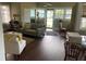 Inviting living room featuring an open door, and multiple windows at 41 W Boyer St, Tarpon Springs, FL 34689