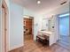 Dressing room with a vanity, a bench and a closet at 44 Pinewood Cir, Safety Harbor, FL 34695