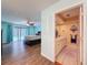 Main bedroom with wood floors leading to the main bathroom at 44 Pinewood Cir, Safety Harbor, FL 34695