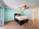 View of the main bedroom with wood floors and a ceiling fan at 44 Pinewood Cir, Safety Harbor, FL 34695