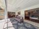 Inviting outdoor space with grill, sofa, tile flooring, and ceiling fan at 44 Pinewood Cir, Safety Harbor, FL 34695