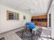 Covered outdoor space with sink, counter space and view of pool at 44 Pinewood Cir, Safety Harbor, FL 34695