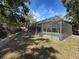 The enclosed pool from outside the enclosure at 44 Pinewood Cir, Safety Harbor, FL 34695