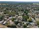 Aerial view of the community showing the layout of the homes, mature trees, landscaping and street designs at 506 Summerwood Ct, Tarpon Springs, FL 34689