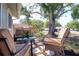 Relaxing front porch with comfortable seating, perfect for enjoying a quiet afternoon outdoors at 506 Summerwood Ct, Tarpon Springs, FL 34689