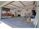 Spacious garage with overhead door, ample storage shelves, and utility connections, offering versatile space at 506 Summerwood Ct, Tarpon Springs, FL 34689