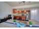 Dining area with stainless steel appliances and granite countertops, seamlessly connected to the kitchen at 506 Summerwood Ct, Tarpon Springs, FL 34689