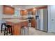 Well-equipped kitchen with granite countertops, a breakfast bar, and stainless steel appliances at 506 Summerwood Ct, Tarpon Springs, FL 34689