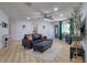 Inviting living room with contemporary furnishings, new flooring, and abundant natural light at 506 Summerwood Ct, Tarpon Springs, FL 34689