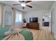 The main bedroom has wood-look floors and offers views through to the living room at 506 Summerwood Ct, Tarpon Springs, FL 34689