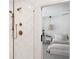 Bathroom with glass enclosed shower, herringbone tile, and bronze fixtures at 5351 Bridge St # 9, Tampa, FL 33611