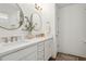 Bathroom featuring double sinks, quartz countertop, shiplap accent wall, and modern fixtures at 5351 Bridge St # 9, Tampa, FL 33611