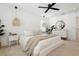 Bright bedroom boasts pendant lighting, modern furniture, and plenty of natural light at 5351 Bridge St # 9, Tampa, FL 33611