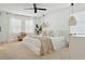 Serene bedroom with neutral tones, large windows, and contemporary lighting fixtures at 5351 Bridge St # 9, Tampa, FL 33611