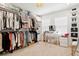 Well-organized walk-in closet boasting ample storage and a vanity area for makeup and personal grooming at 5351 Bridge St # 9, Tampa, FL 33611