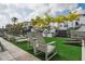 Community area with artificial turf, outdoor grill, lounge chairs at 5351 Bridge St # 9, Tampa, FL 33611