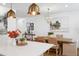 Open dining room showcases a chandelier, decorative prints, and seating for six at 5351 Bridge St # 9, Tampa, FL 33611