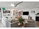 Spacious, converted garage used as living space featuring a large TV, sofa and stylish decor at 5351 Bridge St # 9, Tampa, FL 33611