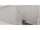 Clean staircase with white railing and hardwood treads at 5351 Bridge St # 9, Tampa, FL 33611