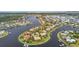 Waterfront community featuring luxury homes, boat docks, and beautiful landscaping from above at 5405 Tybee Island Dr, Apollo Beach, FL 33572
