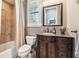 Bathroom with tiled shower, granite vanity, and soft natural light at 5405 Tybee Island Dr, Apollo Beach, FL 33572