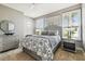 Cozy bedroom with stylish furniture, shutters, and decor at 5405 Tybee Island Dr, Apollo Beach, FL 33572