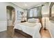 Cozy bedroom features a plush bed, wooden floors, stylish decor, and a relaxing atmosphere at 5405 Tybee Island Dr, Apollo Beach, FL 33572