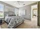 Serene bedroom with neutral colors, plush bedding, and natural light from shuttered windows at 5405 Tybee Island Dr, Apollo Beach, FL 33572