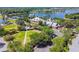 Aerial view of the clubhouse with ample parking, lush green spaces, and scenic lake views at 5405 Tybee Island Dr, Apollo Beach, FL 33572