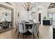 Stylish dining room showcasing a round table, upholstered chairs, tile flooring, and decorative lighting at 5405 Tybee Island Dr, Apollo Beach, FL 33572