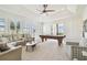 Game room featuring a billiards table, seating, a ceiling fan, and natural light at 5405 Tybee Island Dr, Apollo Beach, FL 33572