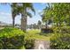 Lush greenery and palm trees frame views of a calm waterfront neighborhood at 5405 Tybee Island Dr, Apollo Beach, FL 33572