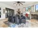 Covered patio with a modern grill area, a fireplace, and a dining table with seating at 5405 Tybee Island Dr, Apollo Beach, FL 33572