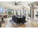 Charming outdoor dining space with a built-in grill, fireplace, and views of the pool at 5405 Tybee Island Dr, Apollo Beach, FL 33572