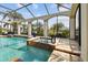 Inviting pool and spa area within a screened enclosure, perfect for relaxation and recreation at 5405 Tybee Island Dr, Apollo Beach, FL 33572