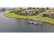 Waterfront estate boasts private boat dock and lift with lush landscaping and serene canal views at 5405 Tybee Island Dr, Apollo Beach, FL 33572