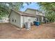 Backyard view of a light green home featuring an air conditioning unit at 602 Lynchburg Dr, Brandon, FL 33511