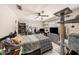 Functional bedroom with a ceiling fan, shelving, a TV, and a playful cat tree at 602 Lynchburg Dr, Brandon, FL 33511