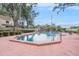 Inviting community pool surrounded by lounge chairs and lush greenery, perfect for relaxation at 602 Lynchburg Dr, Brandon, FL 33511