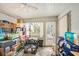 Enclosed sunroom featuring natural light and ample storage space at 602 Lynchburg Dr, Brandon, FL 33511