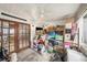 Rear enclosed porch cluttered with an assortment of items providing storage at 602 Lynchburg Dr, Brandon, FL 33511