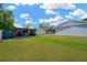 Large backyard with well-kept lawn and shed, offering plenty of space for outdoor activities at 607 Carolyn Dr, Brandon, FL 33510