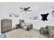 Bedroom with wood-look floors, featuring rustic decor and a ceiling fan at 607 Carolyn Dr, Brandon, FL 33510