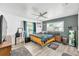 Bedroom featuring contemporary design, wood-look floors, and bright windows at 607 Carolyn Dr, Brandon, FL 33510