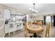 Open floor plan with bright kitchen and eat-in dining room featuring classic table with seating at 607 Carolyn Dr, Brandon, FL 33510
