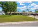 Charming single-story home with a well-manicured lawn and carport offers curb appeal at 607 Carolyn Dr, Brandon, FL 33510